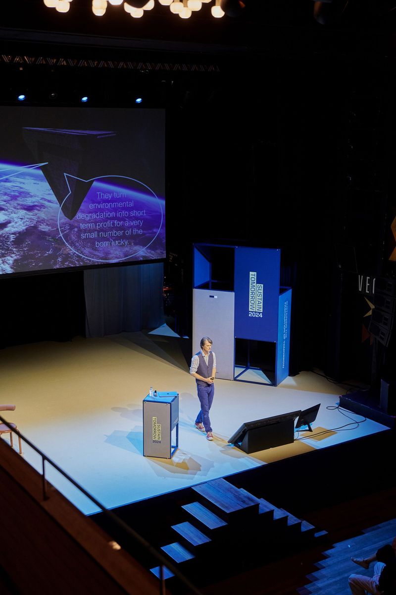 A speaker on stage during Sustain Tomorrow 2024